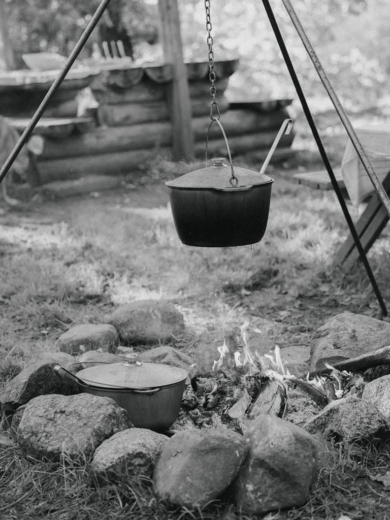A well-used Dutch oven on a kitchen counter