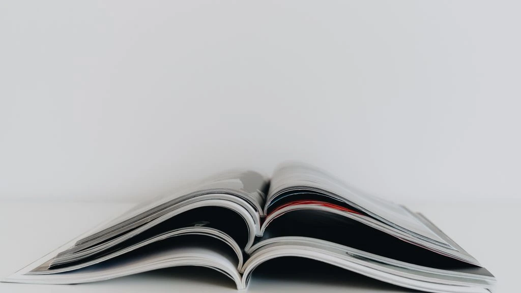 The Kitchen Table Journal, a quarterly print magazine, resting open on a kitchen table in morning light